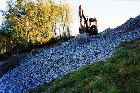 setting rock grade on a steep slope after drainage is installed